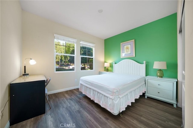 bedroom featuring dark wood-type flooring