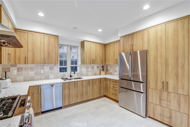 kitchen with decorative backsplash, sink, light brown cabinets, stainless steel appliances, and ventilation hood