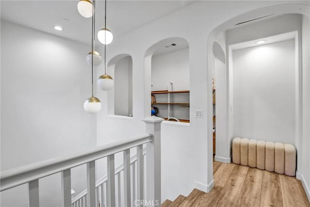 hall with light hardwood / wood-style flooring