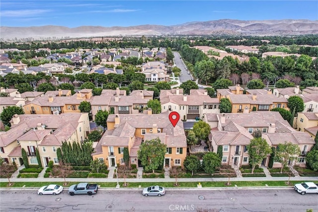 birds eye view of property with a mountain view