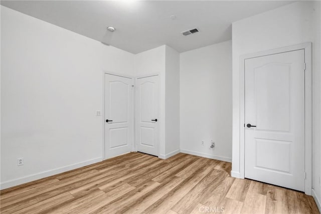 unfurnished bedroom with light hardwood / wood-style flooring