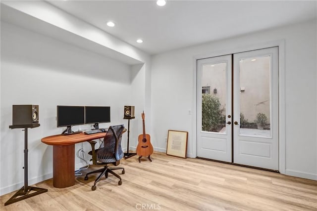 office featuring french doors and light hardwood / wood-style floors