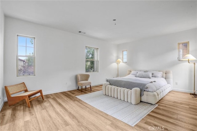 bedroom with light hardwood / wood-style flooring