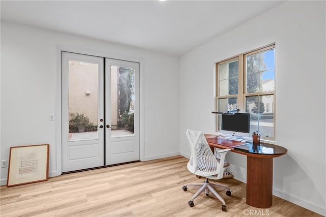 office space featuring light hardwood / wood-style floors and french doors