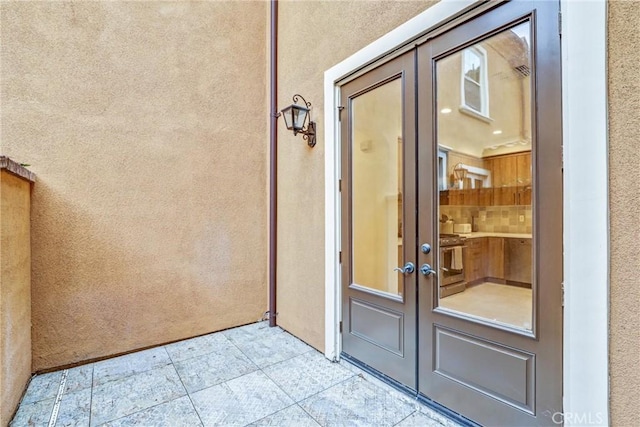 entrance to property featuring french doors