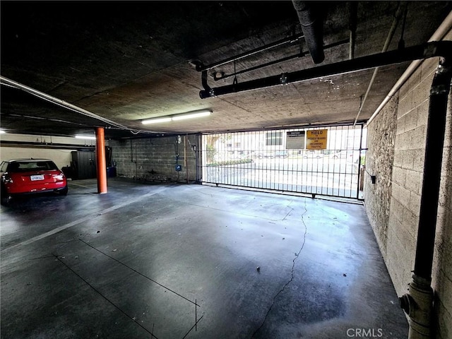 garage with concrete block wall