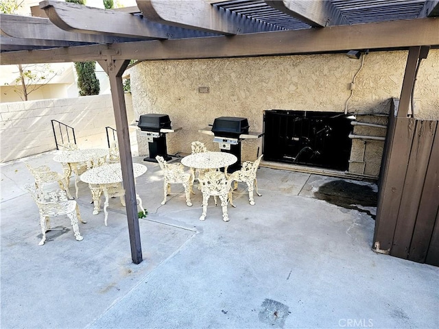 view of patio / terrace featuring fence, a pergola, and area for grilling