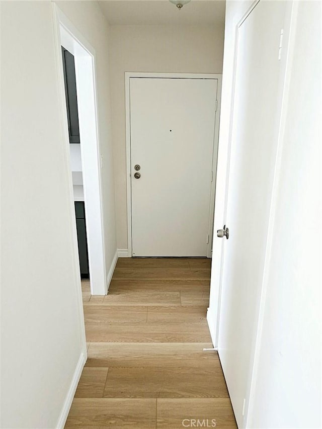 corridor featuring light hardwood / wood-style flooring