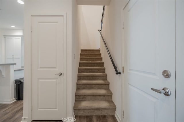 stairway with wood-type flooring