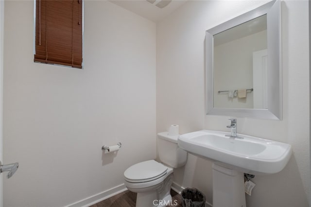 bathroom featuring toilet and hardwood / wood-style floors