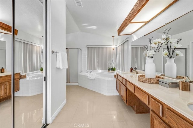 bathroom featuring lofted ceiling, vanity, tile patterned floors, and plus walk in shower