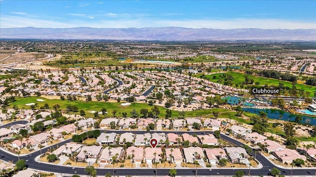 drone / aerial view with a water and mountain view