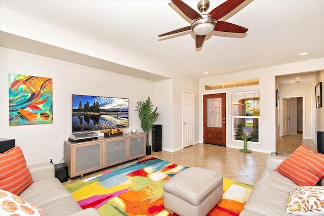 tiled living room with ceiling fan