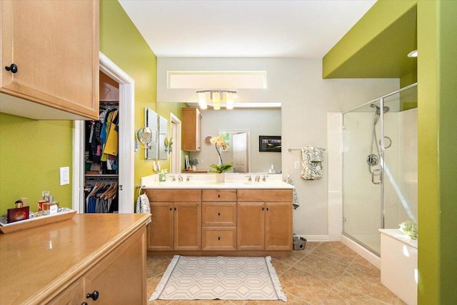 bathroom with vanity, tile patterned flooring, and walk in shower