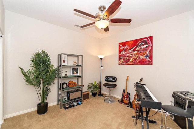 misc room with ceiling fan and carpet flooring