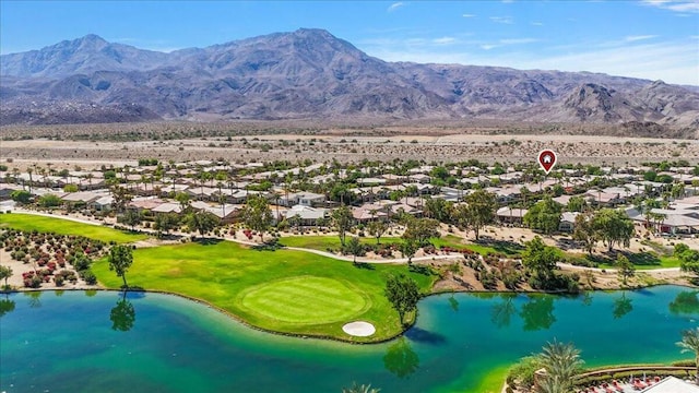 drone / aerial view with a water and mountain view