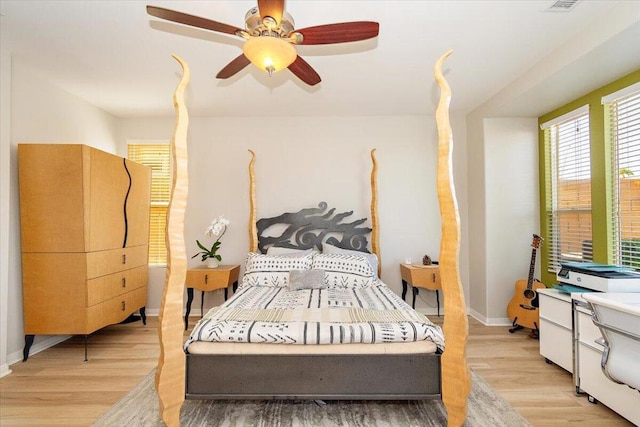 bedroom featuring ceiling fan and light hardwood / wood-style flooring