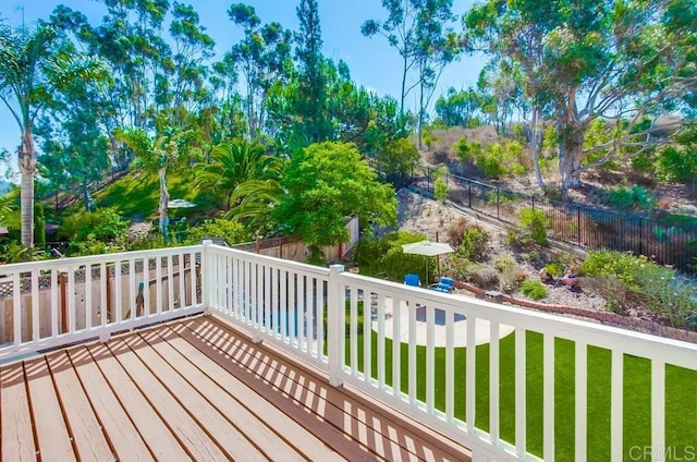 wooden terrace with a yard