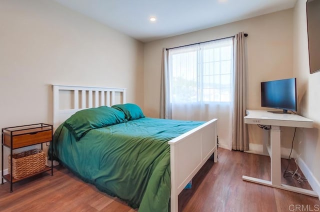 bedroom featuring hardwood / wood-style floors