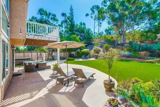 view of community featuring a playground, a patio area, an outdoor hangout area, and a yard