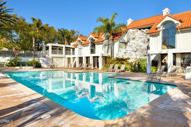 view of pool featuring a patio area