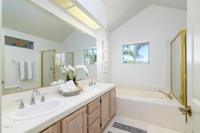 bathroom featuring vanity, lofted ceiling, and shower with separate bathtub