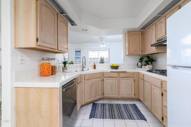 kitchen featuring sink, light brown cabinets, appliances with stainless steel finishes, and tile countertops