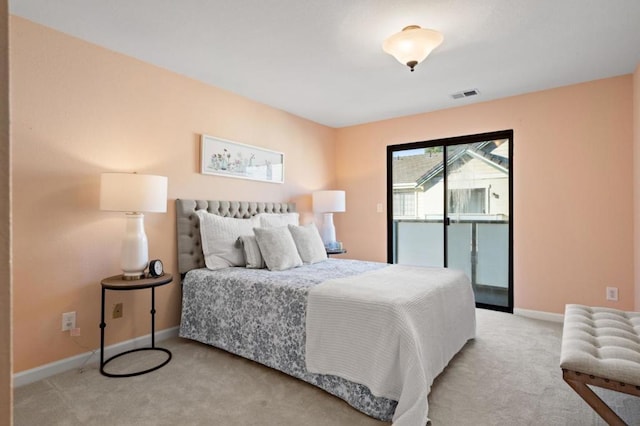 bedroom featuring light carpet and access to outside