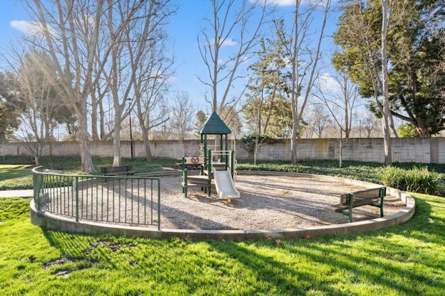 view of playground featuring a lawn