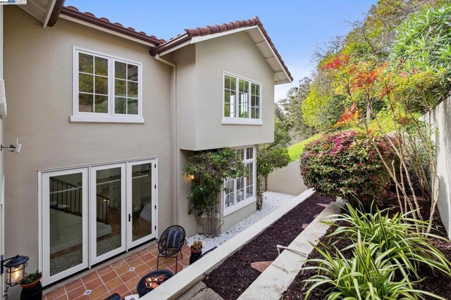 view of side of property featuring a patio