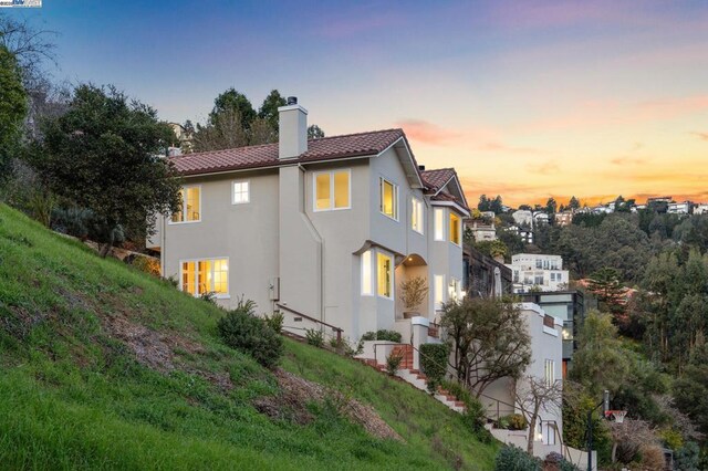 view of property exterior at dusk