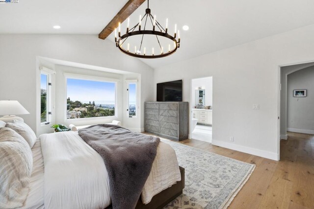 bedroom featuring vaulted ceiling with beams, a notable chandelier, and light wood-type flooring