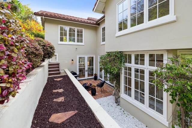 exterior space with french doors and a patio area