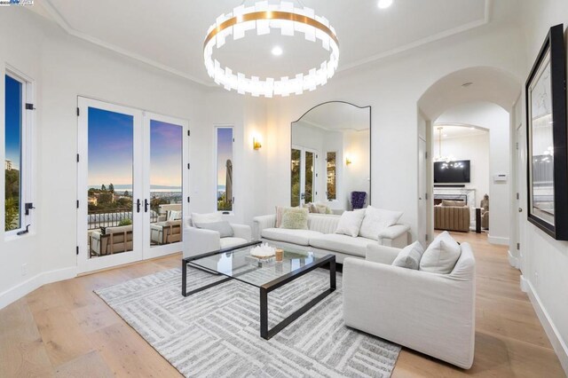 living room featuring light hardwood / wood-style flooring and french doors