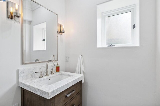 bathroom with vanity and a healthy amount of sunlight