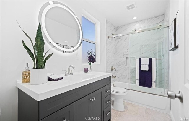 full bathroom with toilet, vanity, and combined bath / shower with glass door