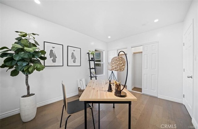 office space with hardwood / wood-style floors