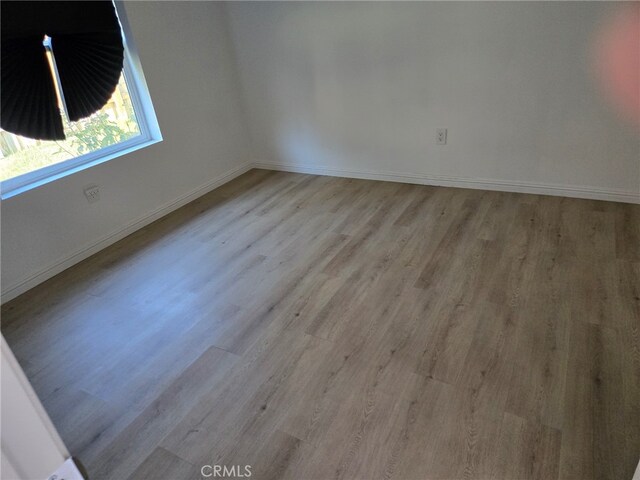 unfurnished room featuring light hardwood / wood-style floors