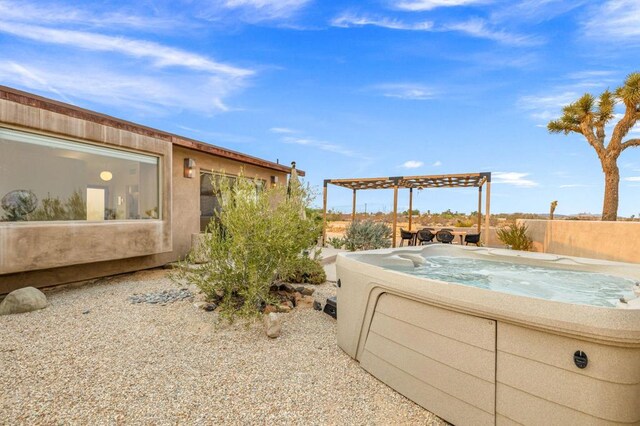 exterior space featuring a hot tub