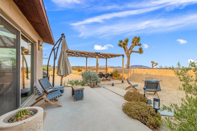 view of patio featuring a pergola