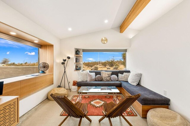 living room featuring lofted ceiling with beams