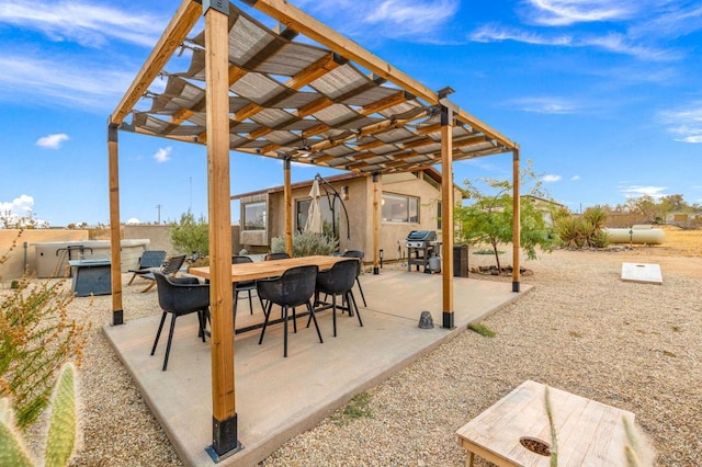 view of patio with a pergola and area for grilling