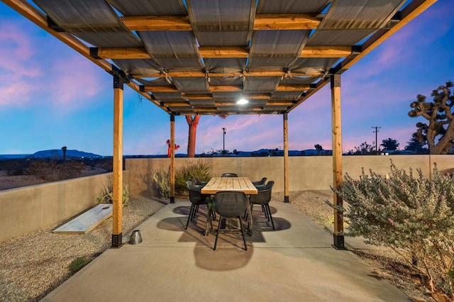 view of patio terrace at dusk