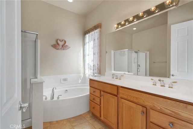 bathroom with vanity, tile patterned floors, and shower with separate bathtub