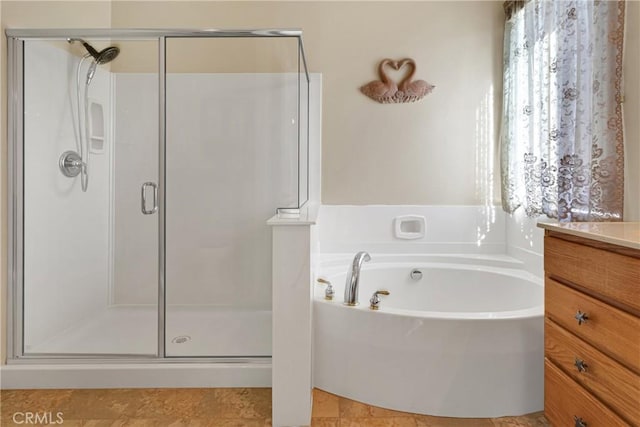 19269 Galloping Hill Rd, Apple Valley, CA 92308 - full bathroom featuring a shower stall, a garden tub, and vanity