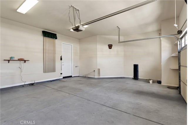 19269 Galloping Hill Rd, Apple Valley, CA 92308 - garage featuring a garage door opener and baseboards