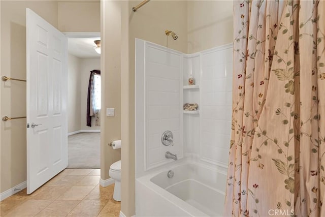 bathroom featuring toilet, tile patterned flooring, and shower / bathtub combination with curtain