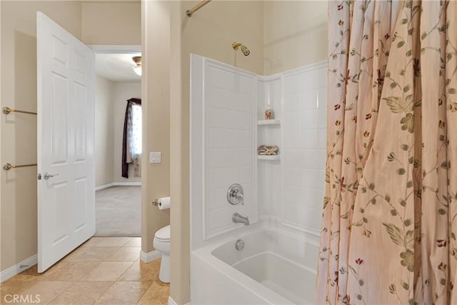 19269 Galloping Hill Rd, Apple Valley, CA 92308 - full bath featuring toilet, baseboards, shower / tub combo with curtain, and tile patterned floors