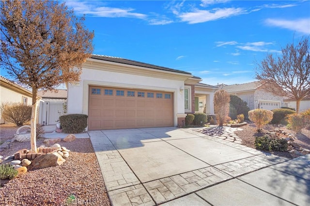 19269 Galloping Hill Rd, Apple Valley, CA 92308 - view of front of property with driveway, stucco siding, a garage, and a tiled roof