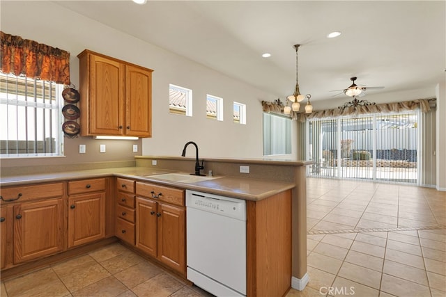 19269 Galloping Hill Rd, Apple Valley, CA 92308 - kitchen featuring white dishwasher, a sink, a peninsula, healthy amount of natural light, and recessed lighting